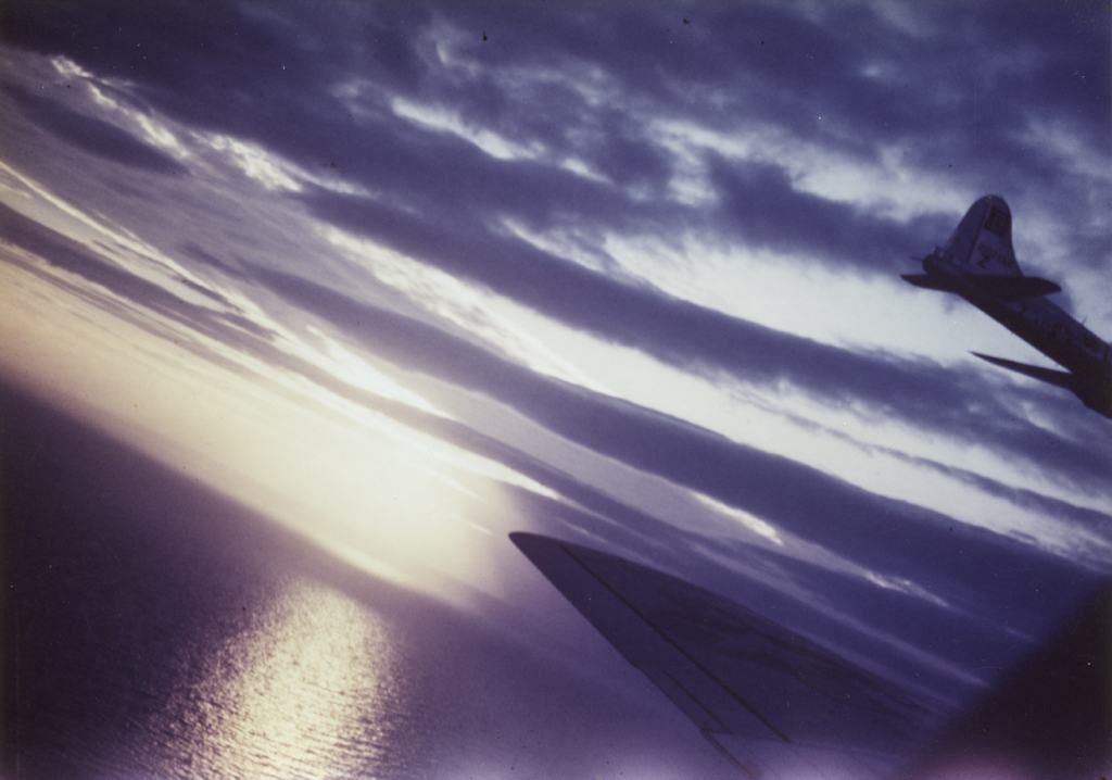 17FlyingFortressofthe100thBombGroupinflightatsunset